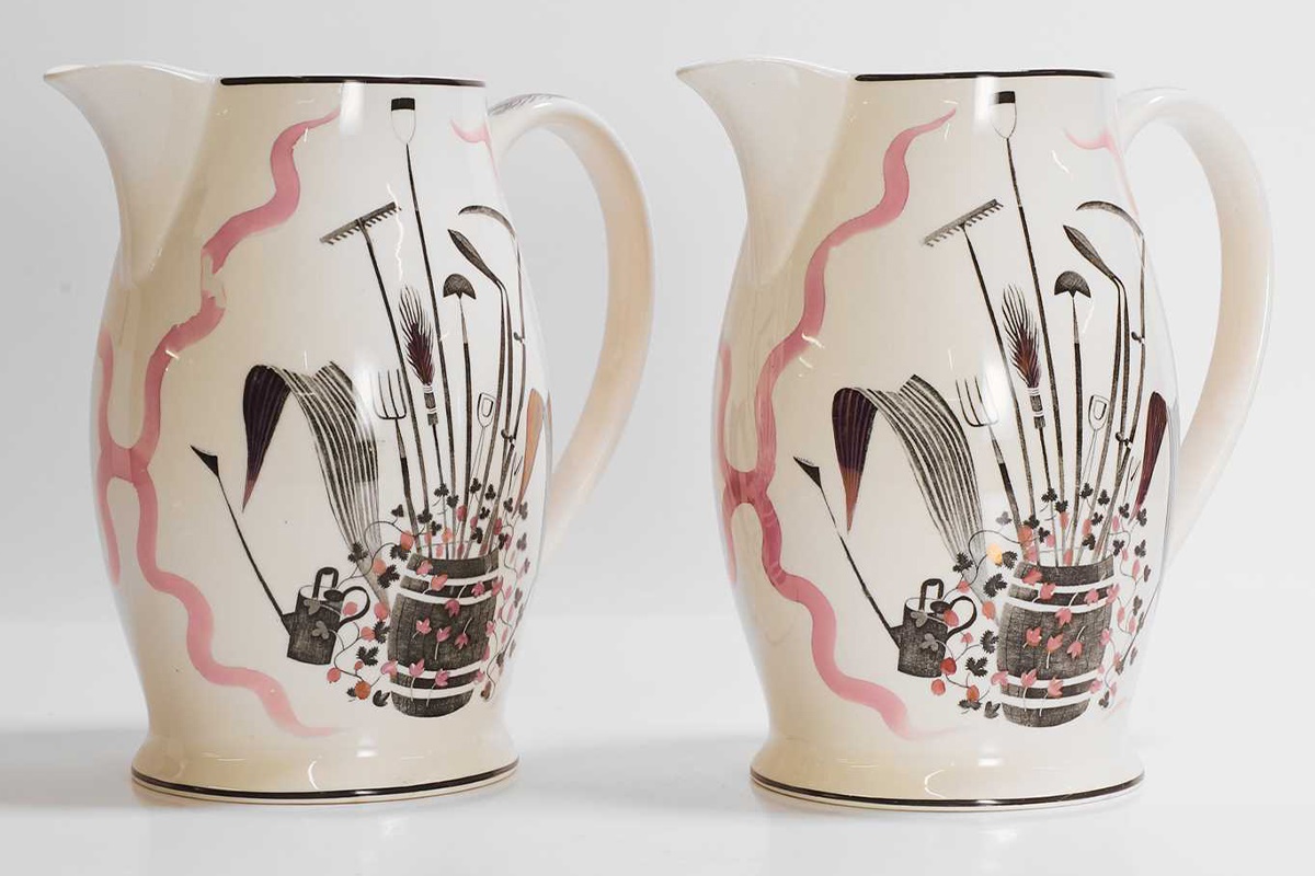 Eric Ravilious (1903-1942) for Wedgwood, a pair of pink 'Garden Implements' lemonade jugs and two accompanying cups (£800-1,200)